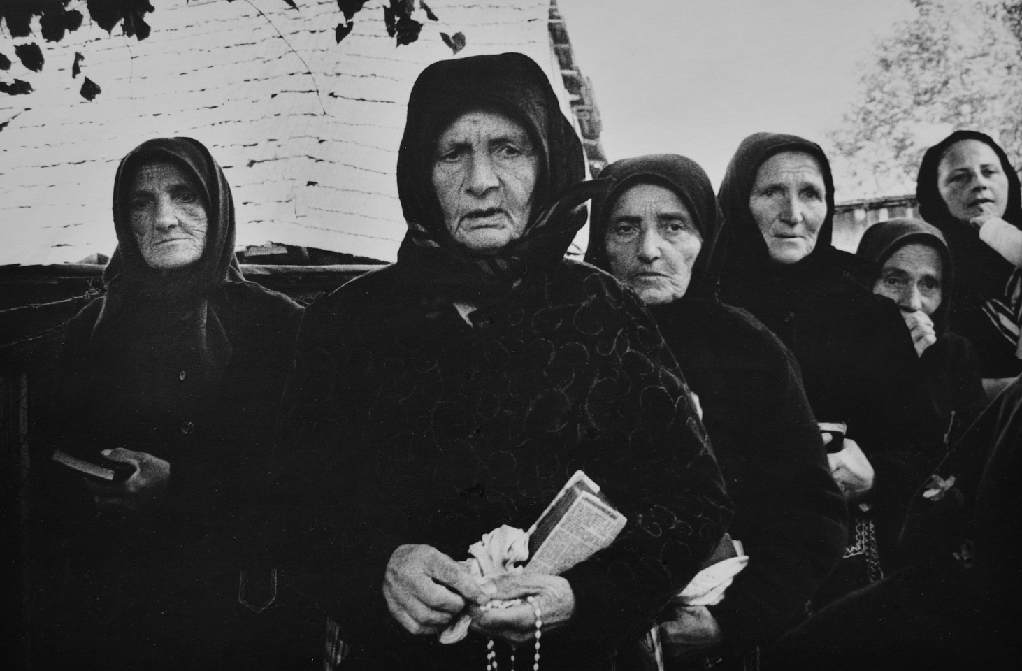 Markéta LUSKACOVA, Old women at the cemetery during the funeral ceremony. From the series 'SÌŒumiac, the mountain village, Slovakia, 1967-74'
1968, Silver Bromide Print