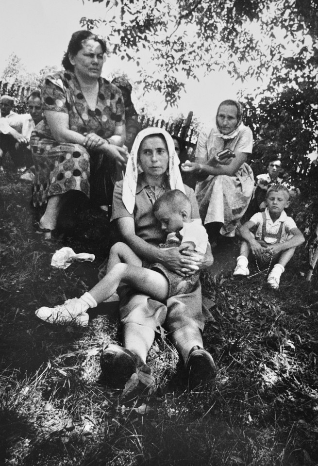 Markéta LUSKACOVA, People sitting outside the the church, St. John's Day, Trhovište
1967, Silver Bromide Print